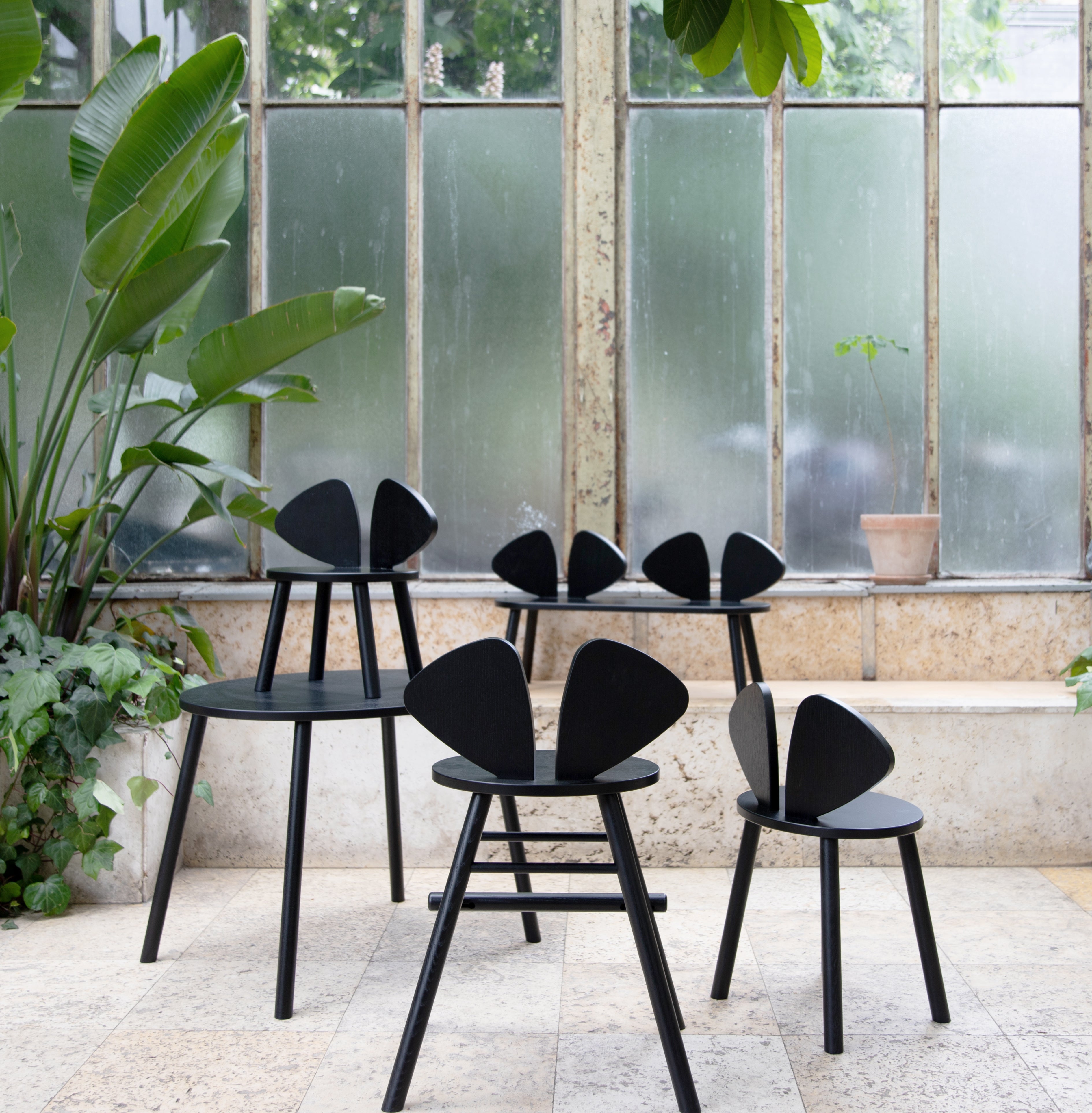 Nofred Black Mouse Chair in the urban scenery