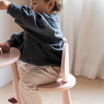 Nofred Rosa Mouse Chair with a kid sitting on it
