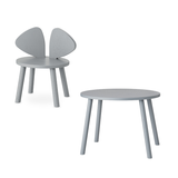 A light gray children's chair with a butterfly-like wing back and a matching round side table, shown on a plain white background.