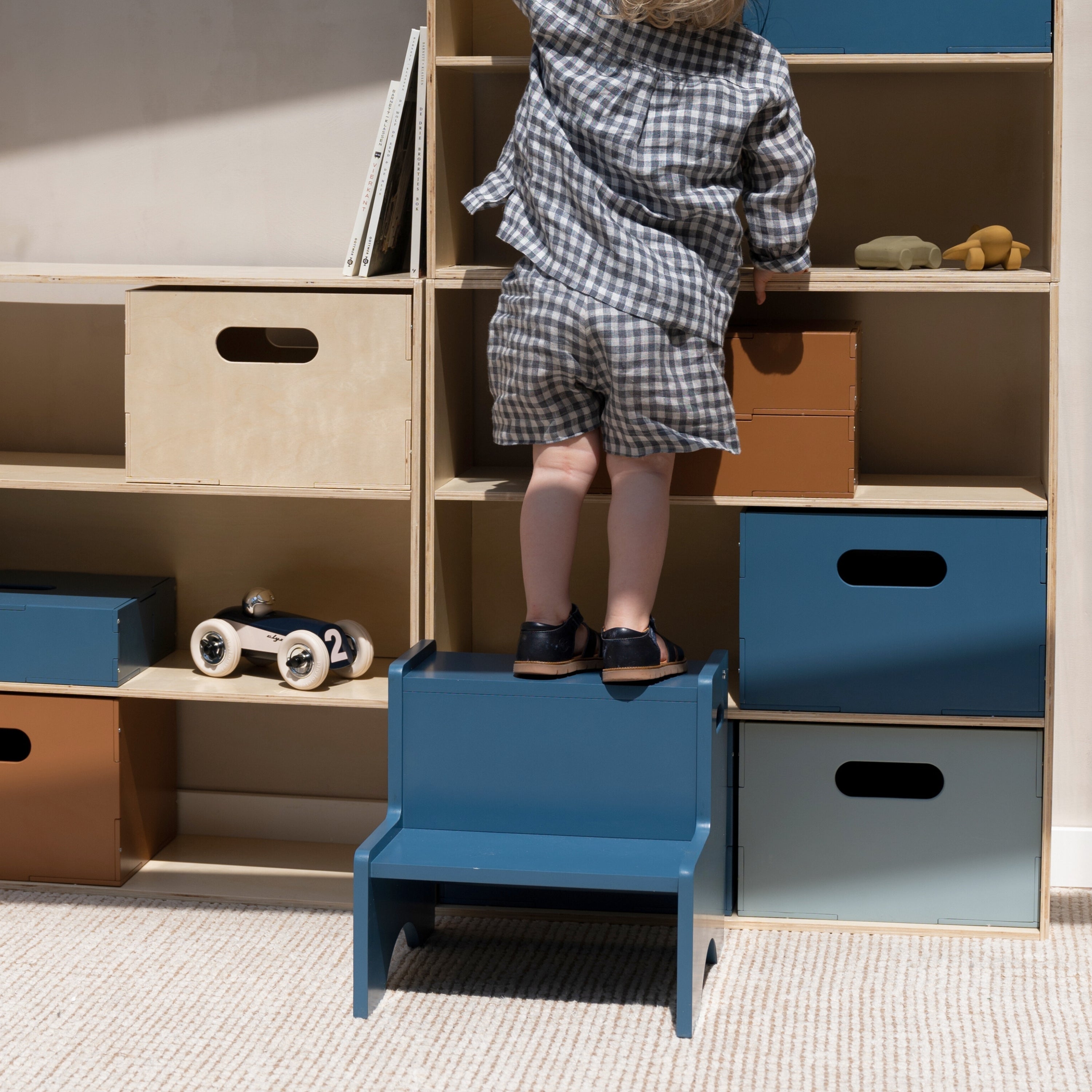 Child staying on the Nofred Blue Step Up Stool 
