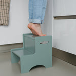Child standing on Nofred Olive Green Step Up Stool