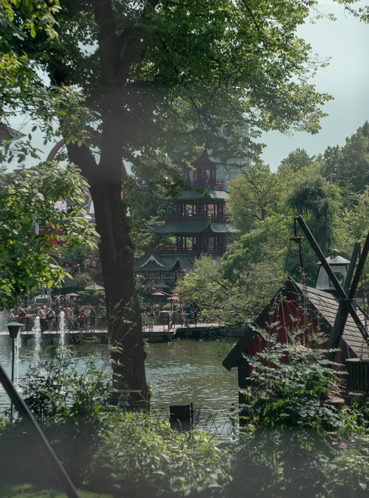 Scenic view of a lake with traditional Chinese architecture and greenery