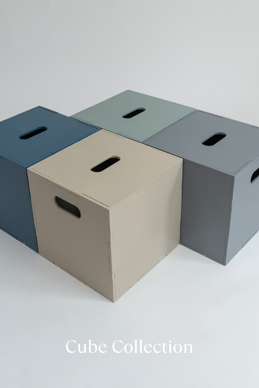 Four cube-shaped storage boxes in different colors on a light gray background with 'Cube Collection' text.