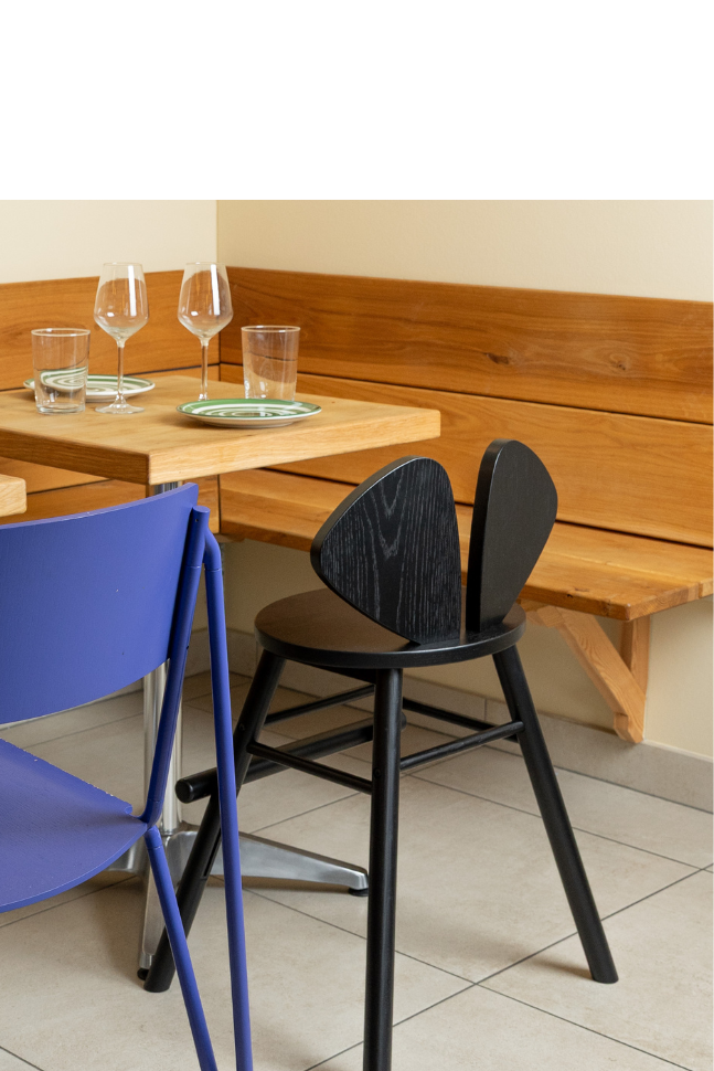 chairs in a dining setting with a neutral background.