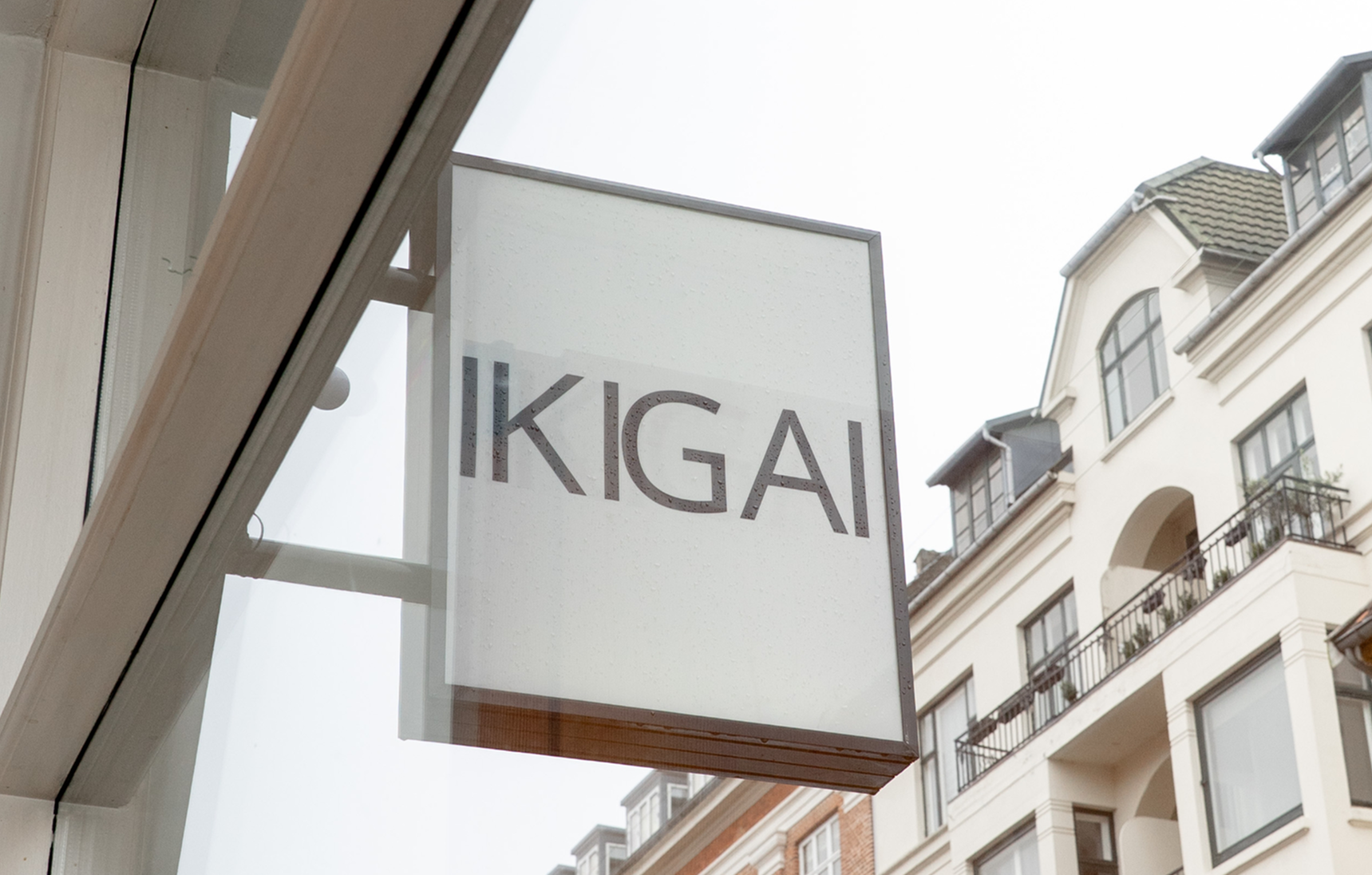 IKIGAI sign on a building facade with residential buildings in the background
