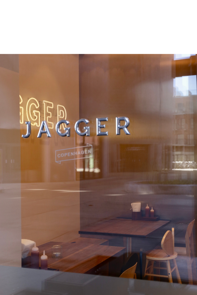 Image of a restaurant interior with 'Jagger' branding on the walls.