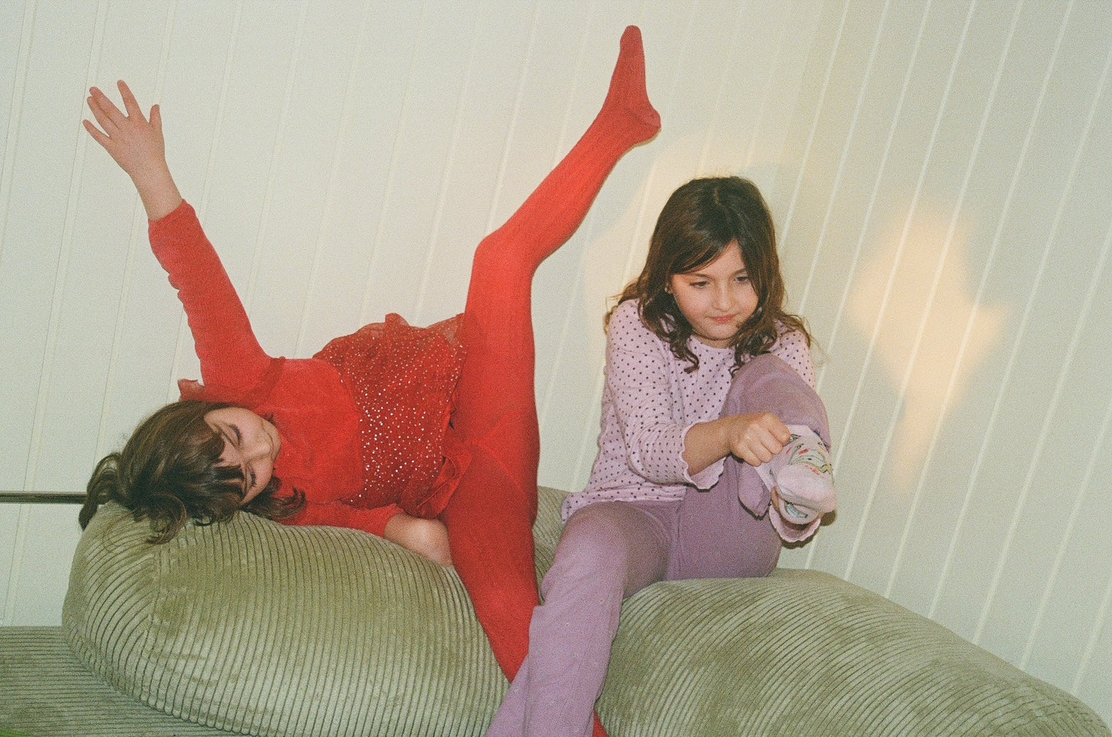 girls playing on the sofa