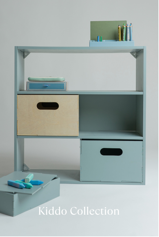 Children's desk with storage boxes and stationery, labeled 'Kiddo Collection'.
