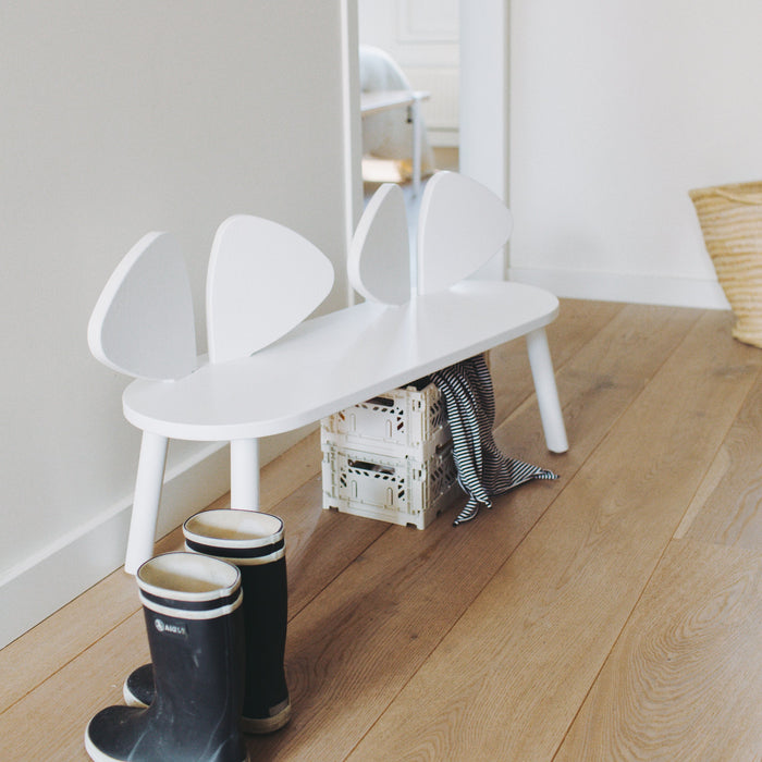 Kids bench in white, placed in entrance area