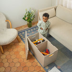 Child playing with toys on Long Cube storage in a living room.