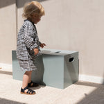 Nofred Olive Green Cube Long Storage with a child nearby