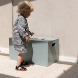 Nofred Olive Green Cube Long Storage with a child nearby