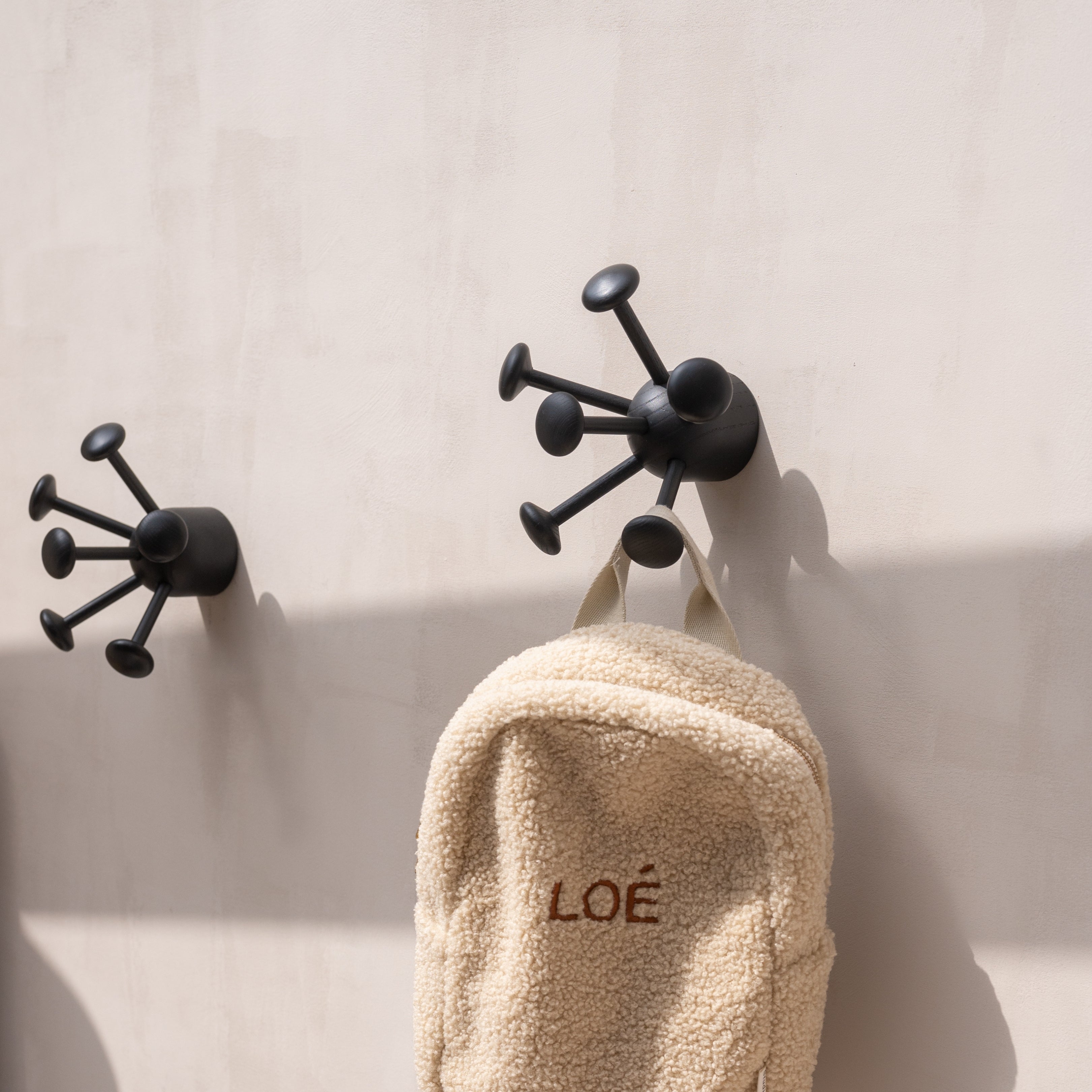 Nofred Black Wall Bug Hook with clothes hanging