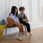 Kids taking shoes off sitting on Nofred Grey Mouse Bench