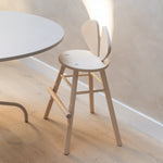 Nofred Birch Mouse Chair Junior next to the table