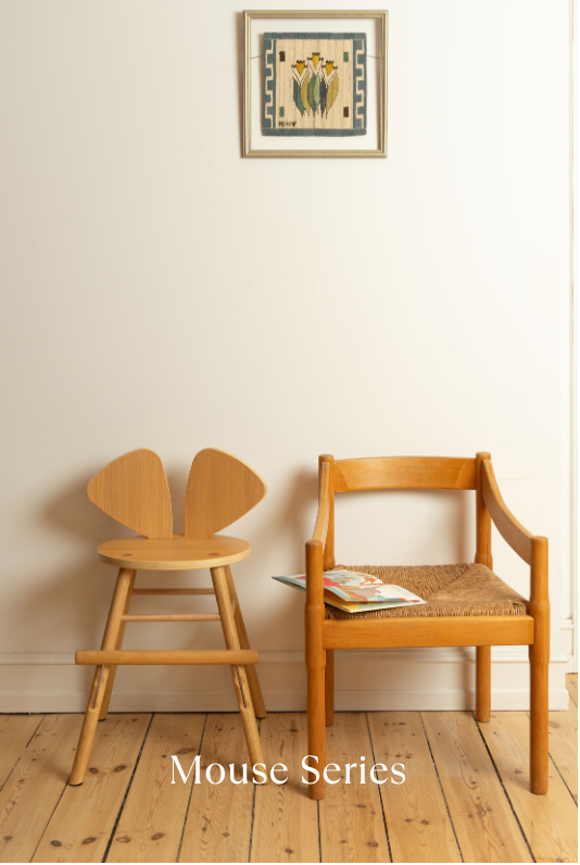 Two wooden chairs with a 'Mouse Series' label on a wooden floor.
