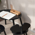 Nofred Black Mouse Table with school gear on it