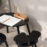 Nofred Black Mouse Table with school gear on it