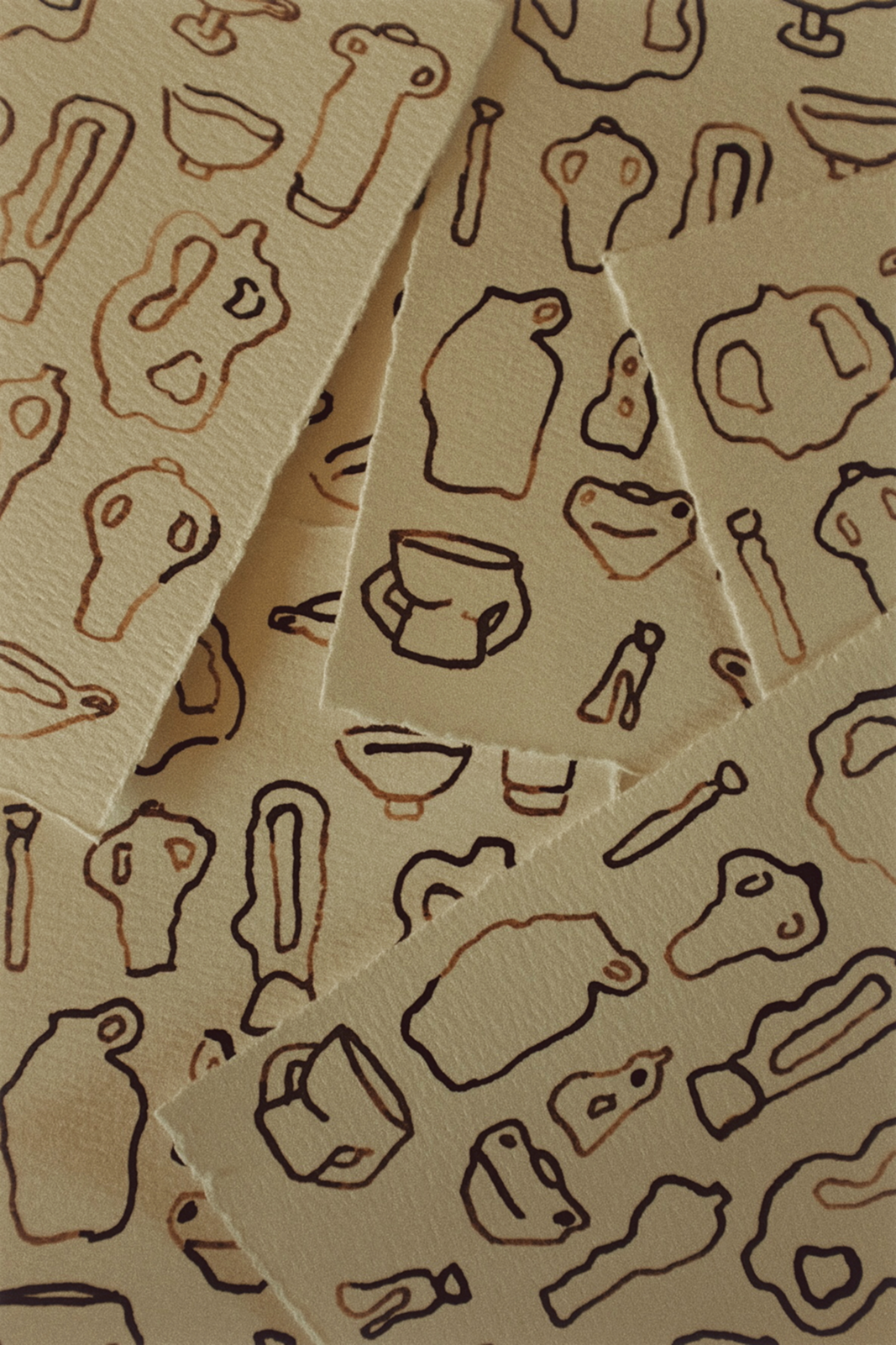 Patterned paper with brown line drawings on a beige background