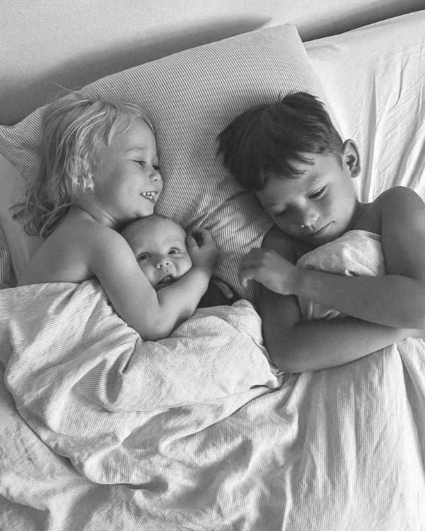 kids lying in bed