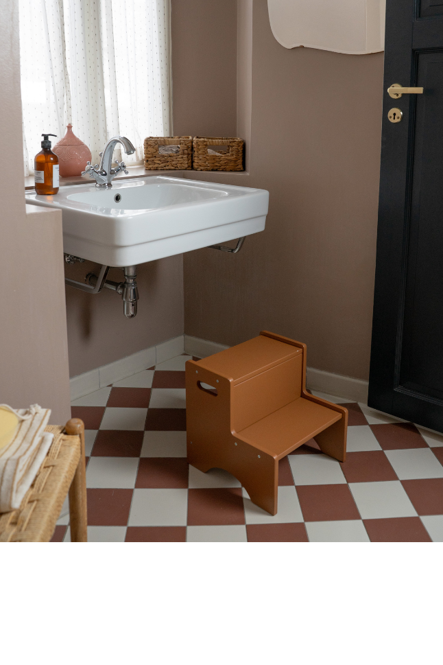 Bathroom with checkered floor and white sink